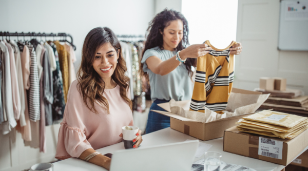 Two women reviewing inventory in a small business