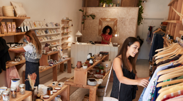 Two women shopping in a boutique clothing store