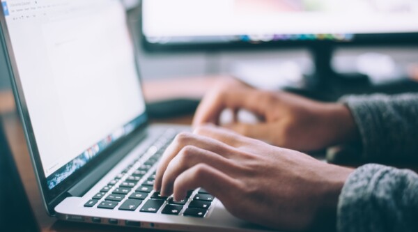 Person typing on a laptop