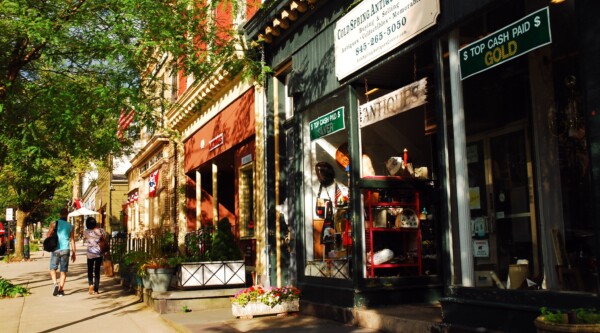 People walk along the main shopping district of Cold Spring, New York