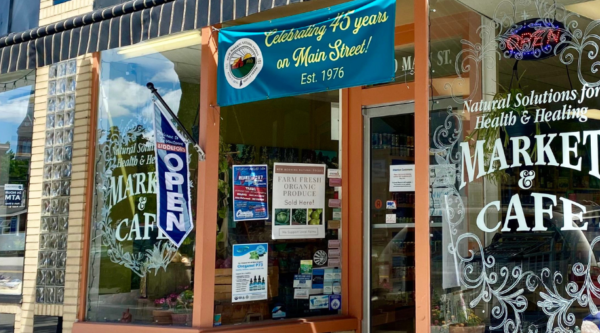 Small business storefront with banners and window decorations