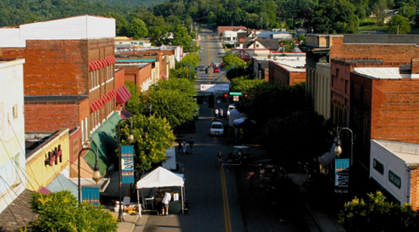 Aerial photo of a downtown street with red brick buildings