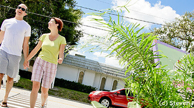 Couple holding hands in Audubon Park in Orlando, Florida