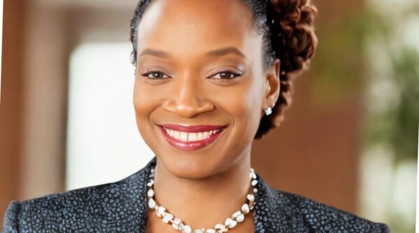 Professional woman smiling in office setting.