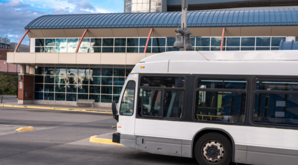 Bus pulling up to a bus terminal