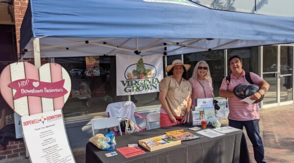 A booth with informational leaflets at a farmers market